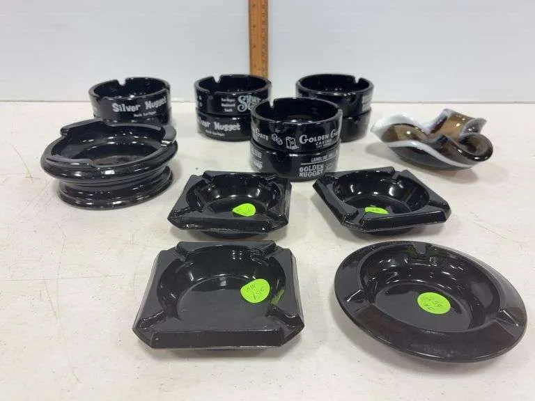 Assortment of black glass ash trays