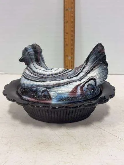 Purple slag glass hen on a nest