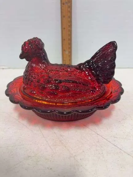 Ruby red hen on a nest- possibly Mosser