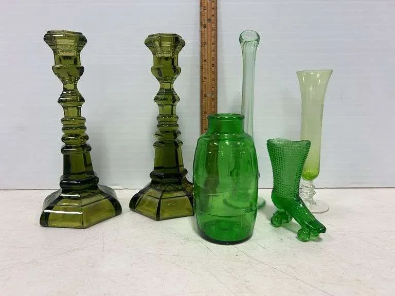 Green candle holders, vases & roller skate
