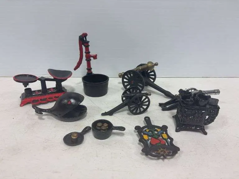 Cast iron canyon, water pump, whale ash tray, scale, stove, trivet, & more
