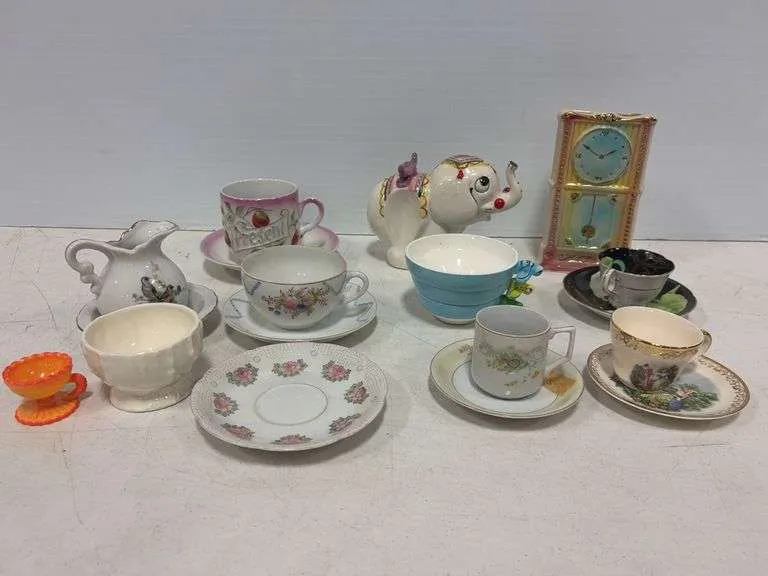 Shawnee clock vase, ceramic elephant, measuring cups, cups & saucers, misc