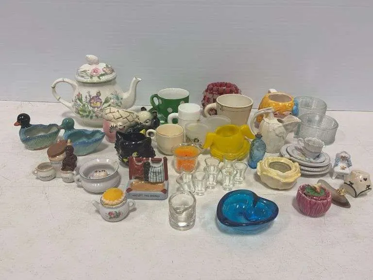 Large assortment of ceramic, pottery & glass pieces- includes cups & saucers, ashtrays, teapot & more