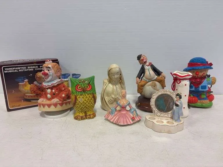 Musical rotating clowns, owl coin bank, vase, misc