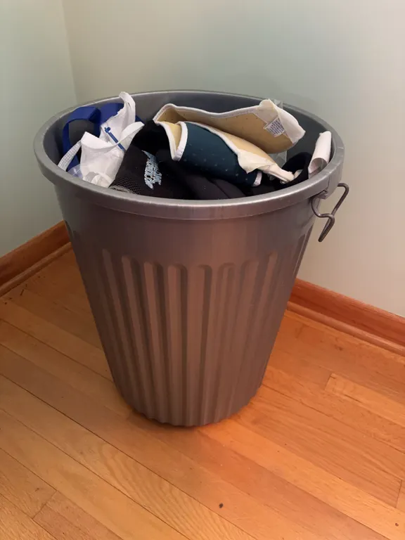 Plastic garbage can and contents