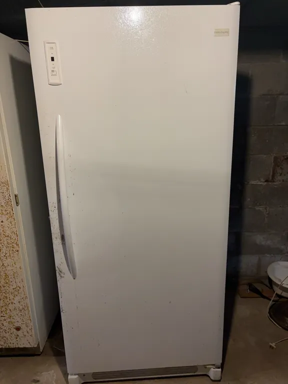 Frigidaire upright freezer Located in Basement