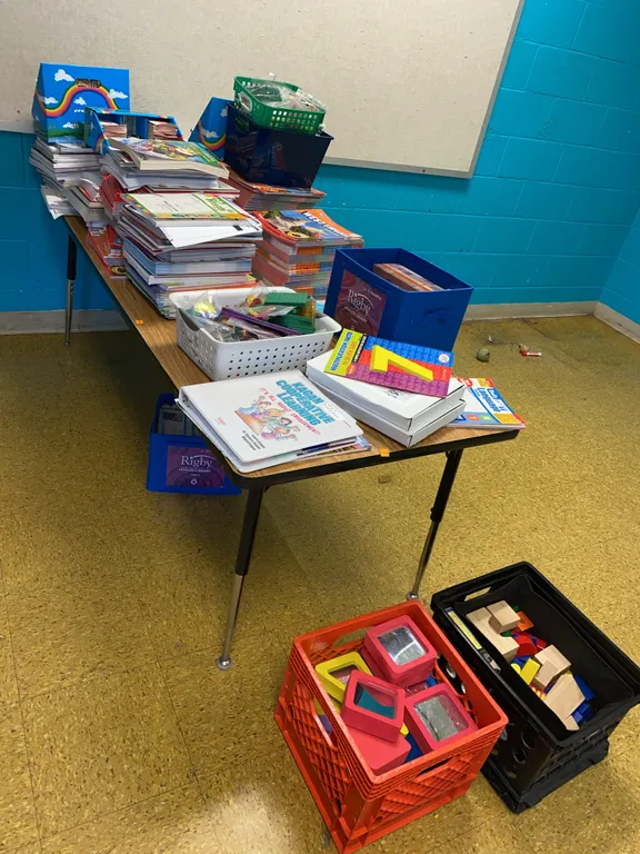 6 foot wooden table with learning material