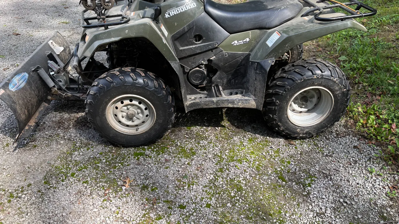 Suzuki 4 wheeler with 4 way blade