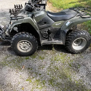 Suzuki 4 wheeler with 4 way blade