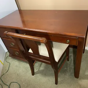 Unmarked wooden desk and chair