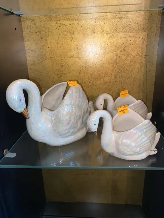 Iridescent ceramic swan’s