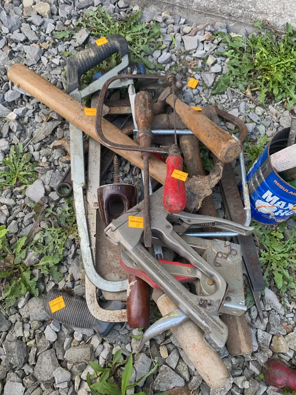 Assortment of hand tools, hammers, pipe cutter and more