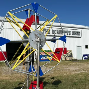 Miniature Ferris Wheel with Red Seats and Multi-Color Frame in working condition