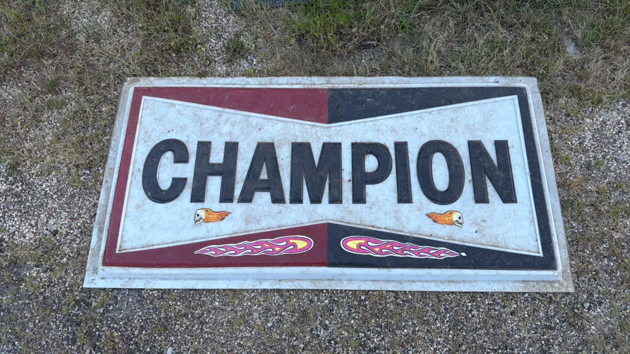 Vintage Champion Advertising Sign with Flaming Skulls and Flames