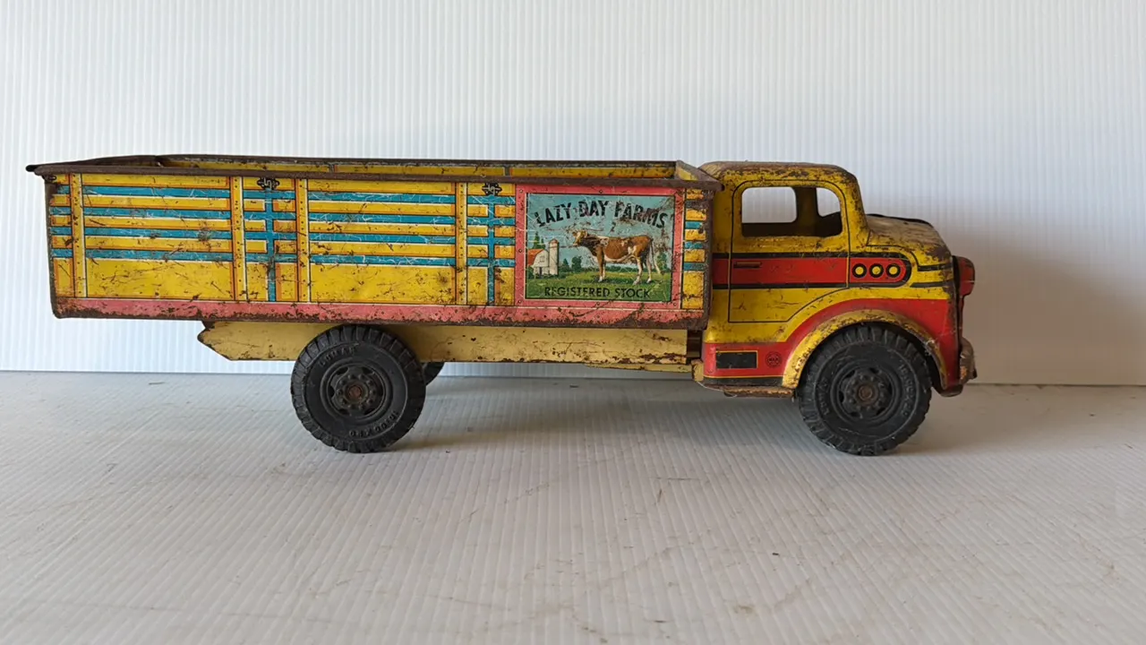 Vintage tin toy truck with 'Lazy Day Farms' livery