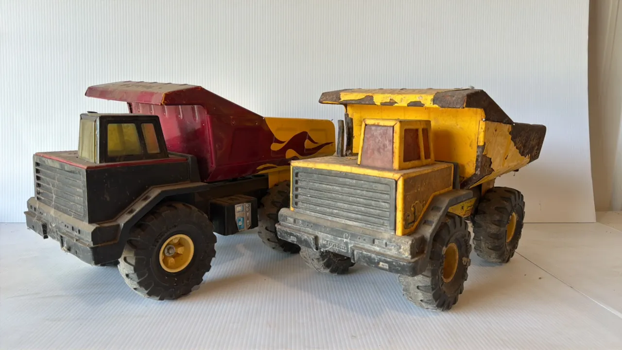 Tonka Toy Dump Trucks, Two Vintage Metal Trucks, One Black and Red with Flame Decals, One Yellow