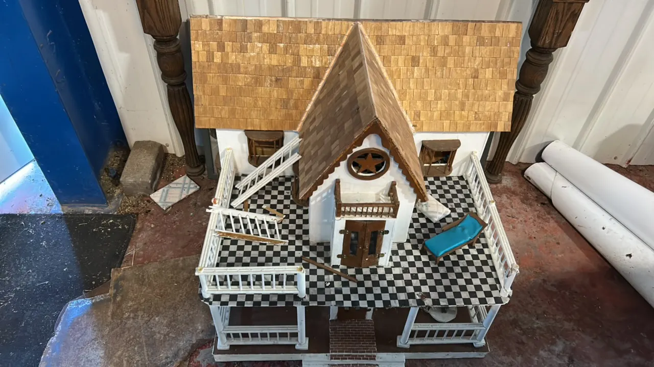Dollhouse with Wooden Shingle Roof, Black and White Checkered Porch, and Star Gable Detail