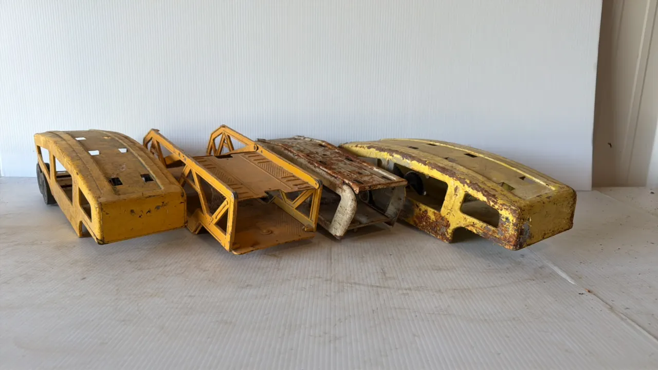 Four Vintage Yellow Metal Toy Car Carrier Sections