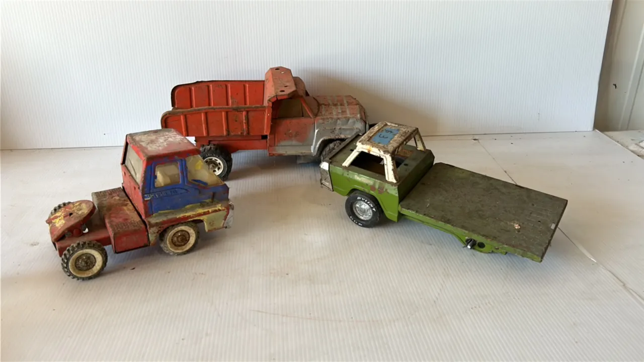 Lot of Vintage Metal Toy Trucks, including Red Dump Truck, Semi Cab, and Flatbed