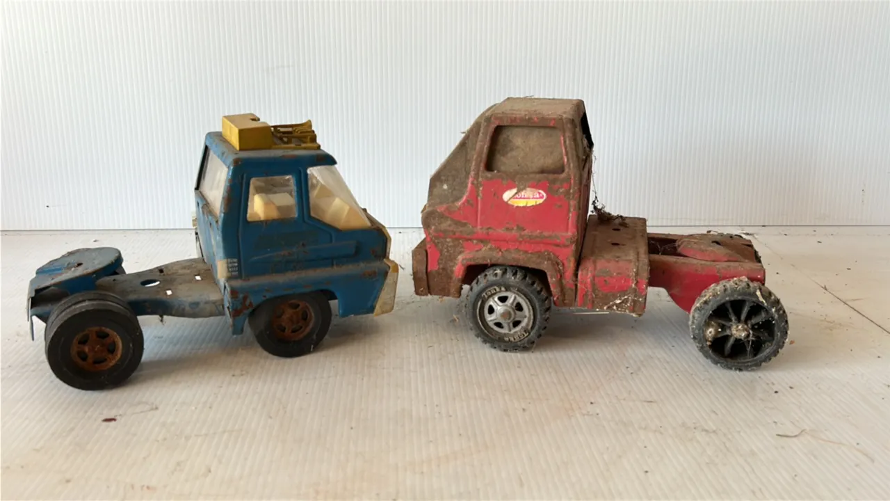 Two Vintage Toy Truck Cabs, one red Tonka and one blue