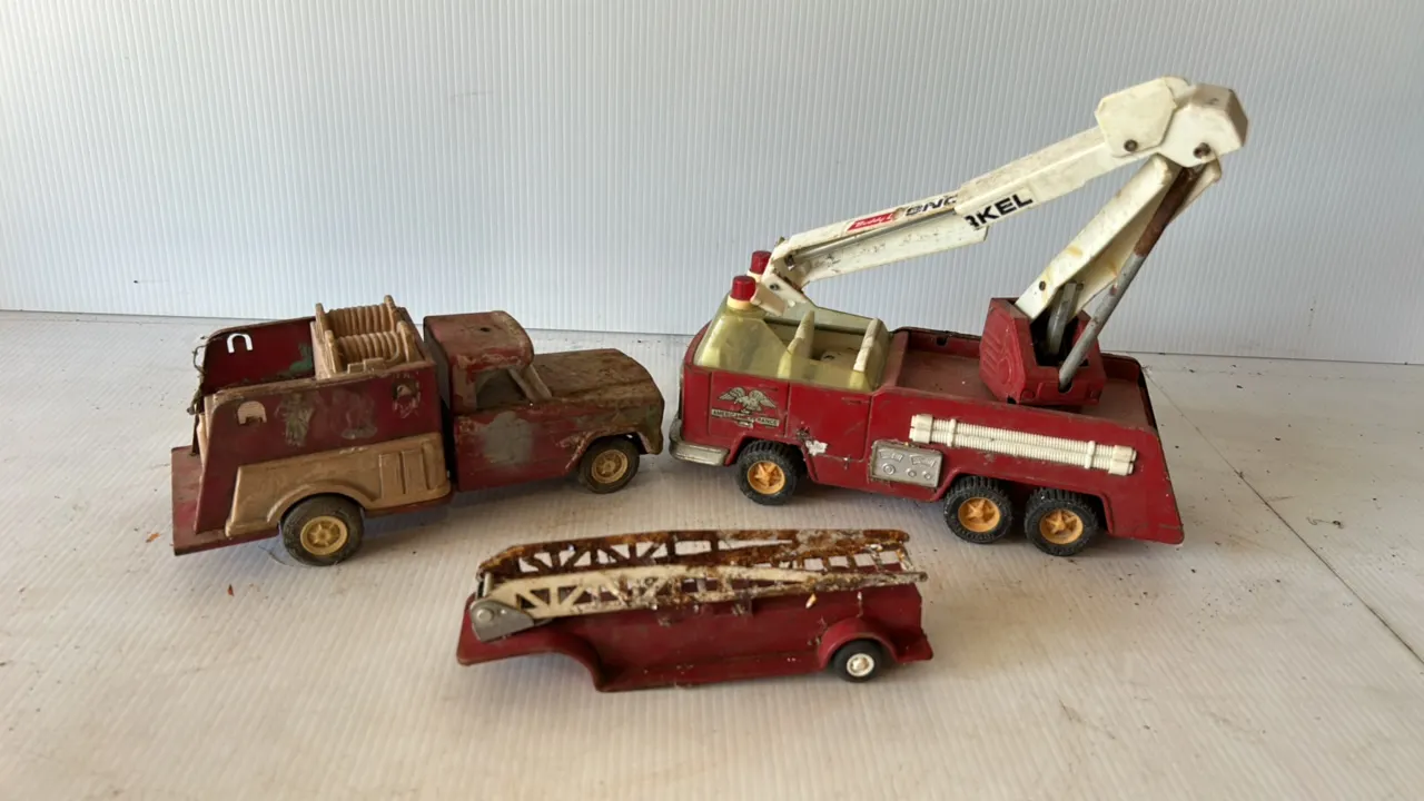 Collection of Vintage Toy Trucks including Buddy L American LaFrance Aerial Ladder Fire Truck