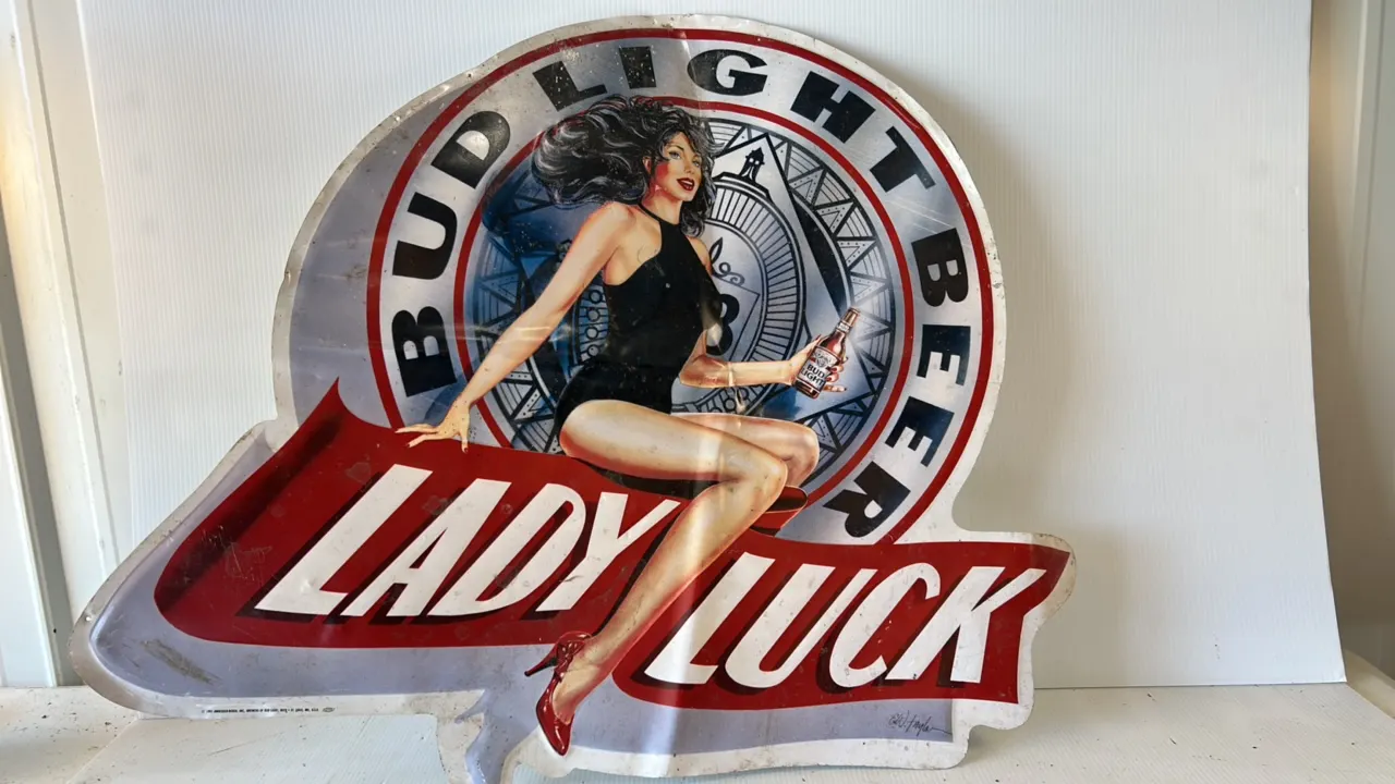 Bud Light Beer 'Lady Luck' Metal Advertising Sign featuring Pin-Up Woman