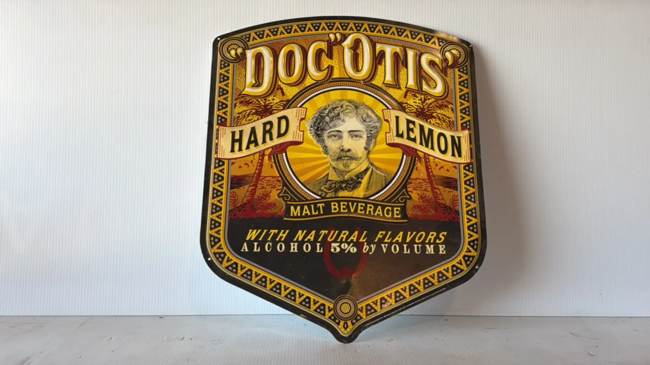2007 Doc O'Tis Hard Lemon Malt Beverage Embossed Metal Shield Advertising Sign