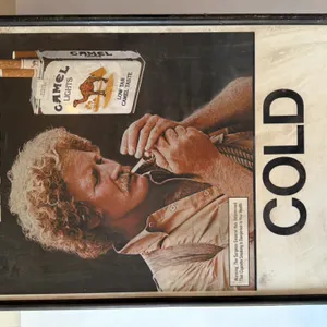 Camel Lights Advertising Sign featuring man lighting cigarette and 'COLD BEER' text
