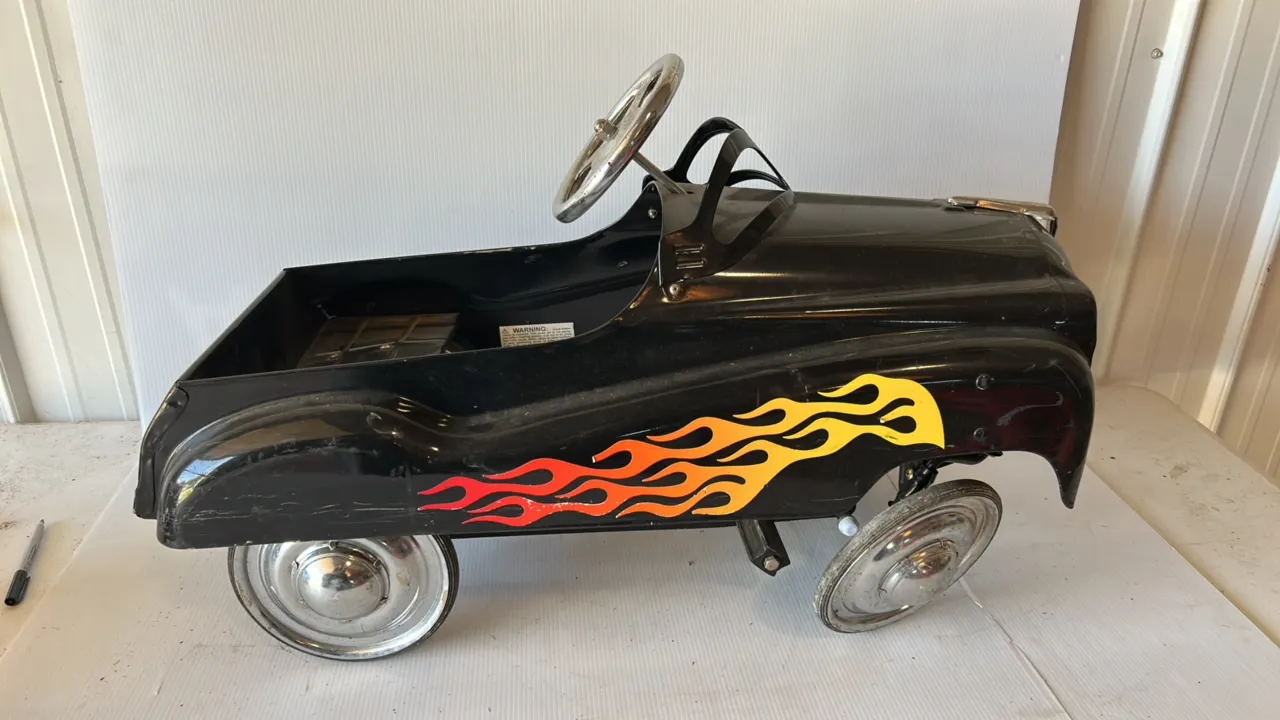 Black Pedal Car with Flame Graphics