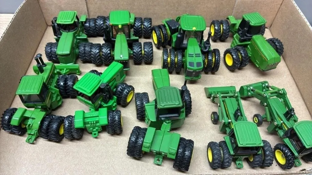 9 Asst. 1:64 John Deere Tractors.