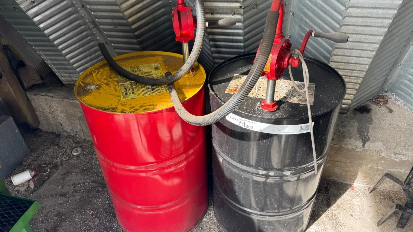 2) 50 Gallon oil barrels w/ hand pumps