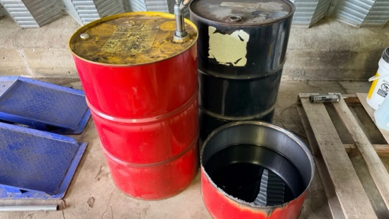 2) 50 Gallon oil barrels w/ oil pan