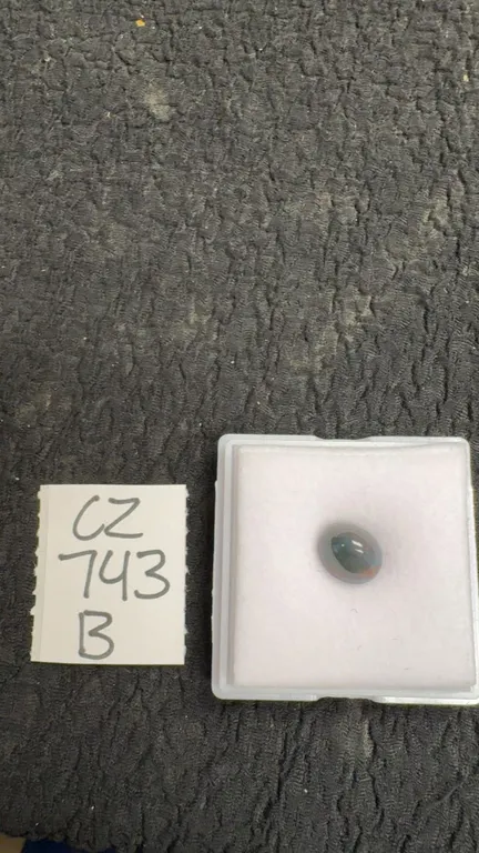 2.8 Carat Natural Untreated Black Opal Oval Cabochon, 8.4mm x 9.9mm