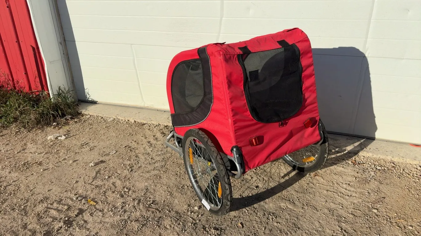Red Two-Wheeled Child / Pet Trailer with Black Mesh Windows and Metal Frame