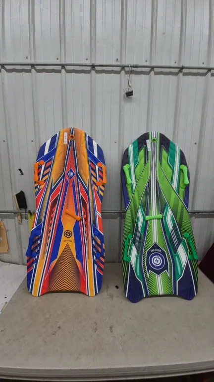 Two Sno-Storm Snow Sleds, Orange and Blue, Green and Blue, with Handles and Pull Ropes never used