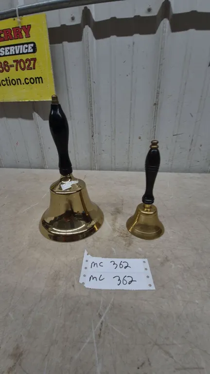 Two Brass Schoolhouse Hand Bells with Black Wood Handles