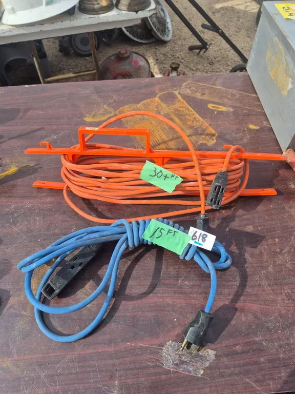 2 extension cords, one on a reel.