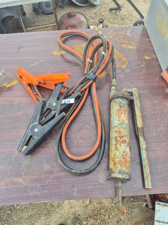Booster cables and a grease gun.