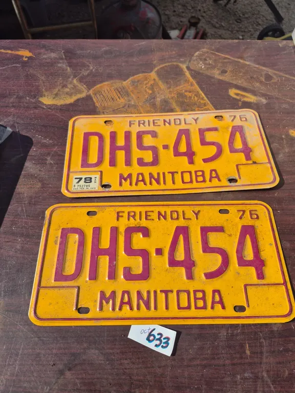A set of vintage Manitoba license plates