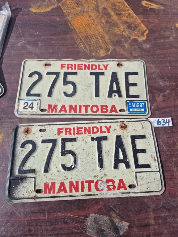A set of vintage Manitoba license plates