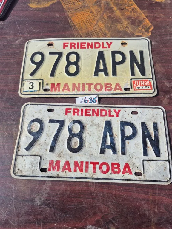 A set of vintage Manitoba license plates