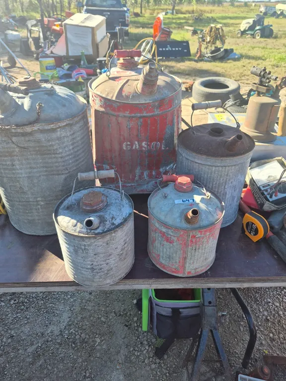 5 vintage galvanized cans, one dented