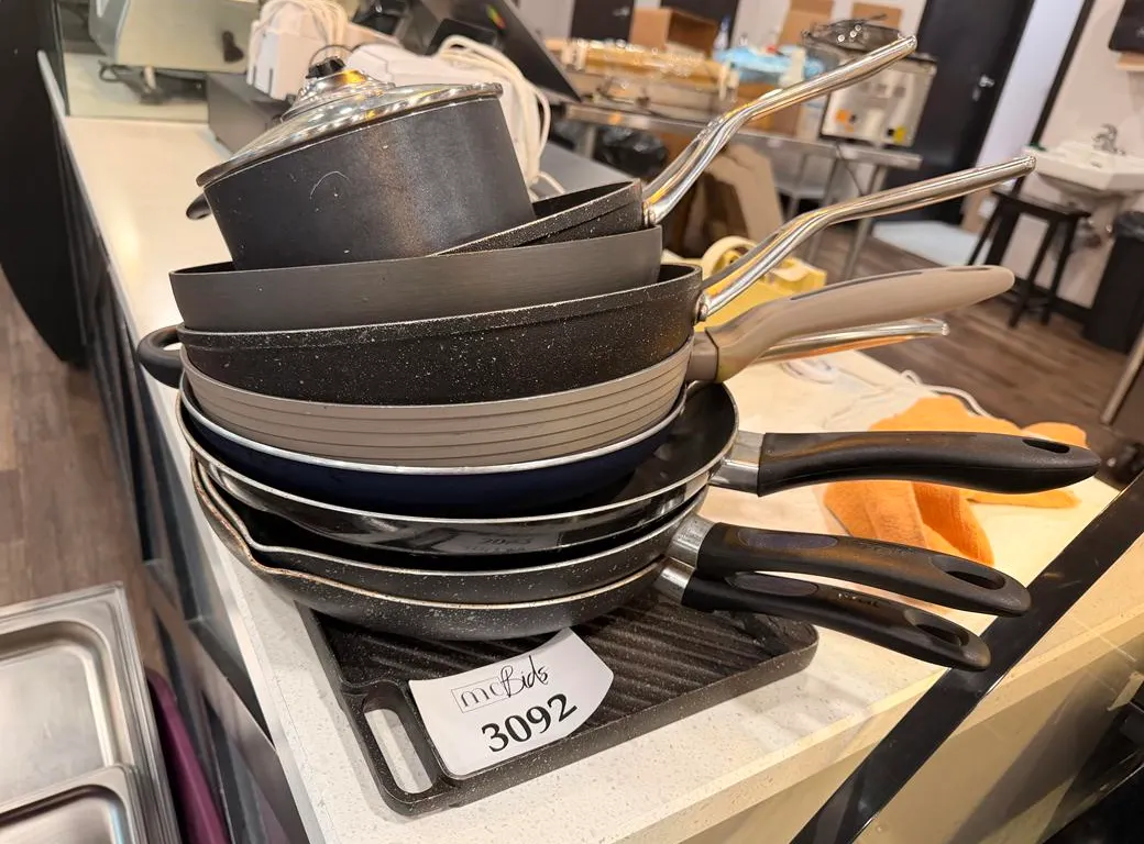 Cast Iron Griddle and Assortment of Frying Pans
