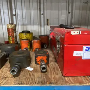 RED METAL TOOL BOX & ASSORTED HYDRAULIC RAMS