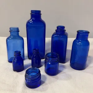 Eight Vintage Blue Glass Bottles & Jars