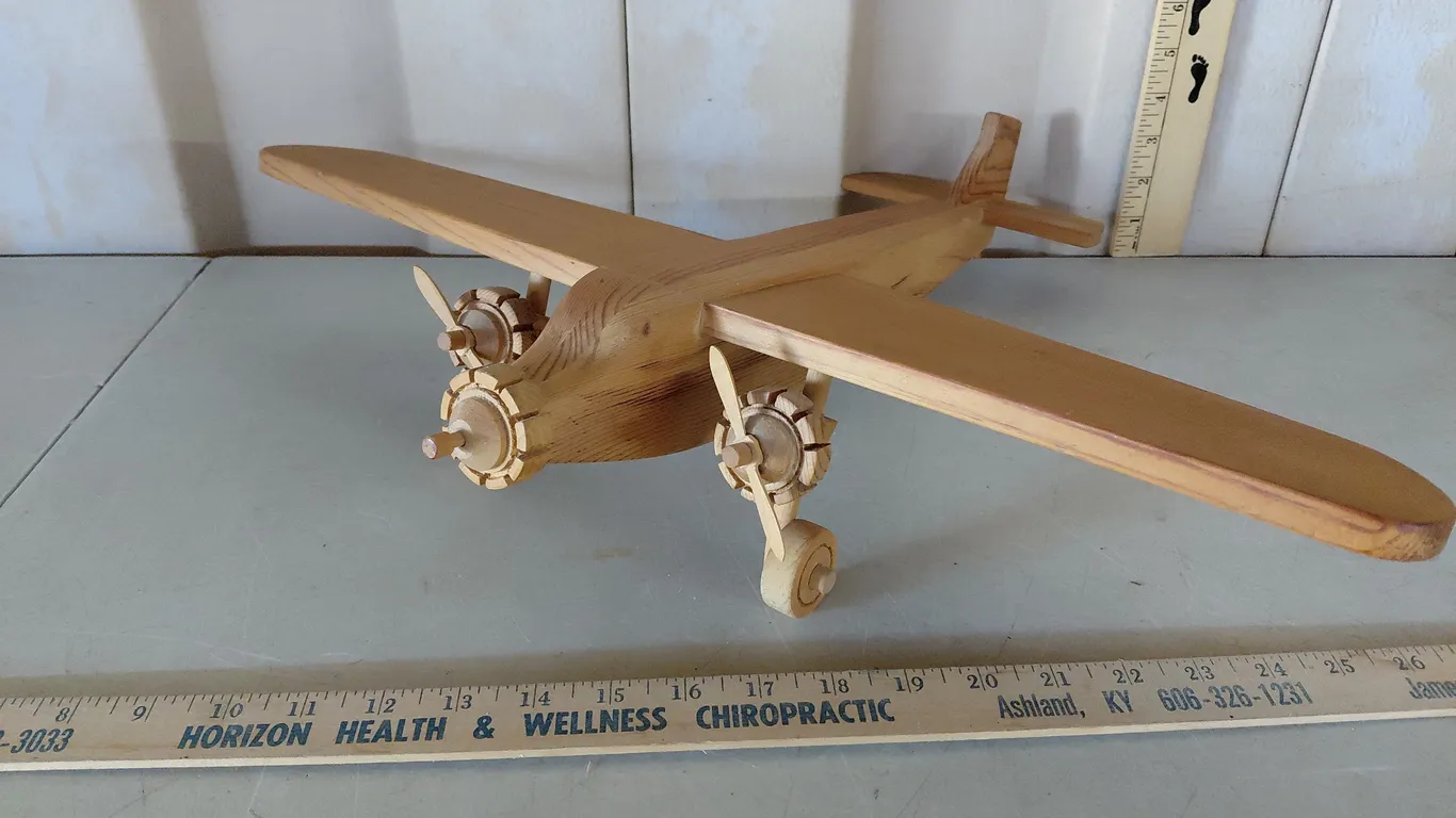 1986 P.C.G. Wooden Plane 21"X18"X4.25", Missing Front Propeller