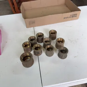Nine brass couplers, 1 inch, 1 1/4 brass coupler