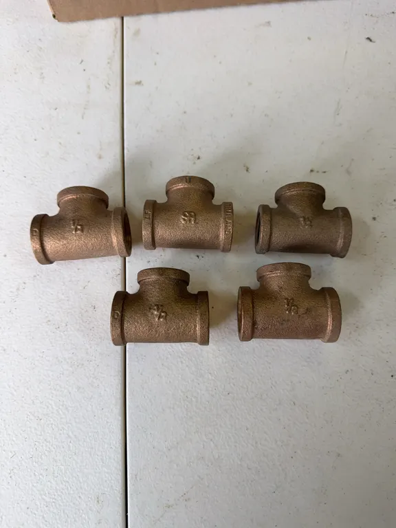 Five threaded brass t fittings 1/2 inch