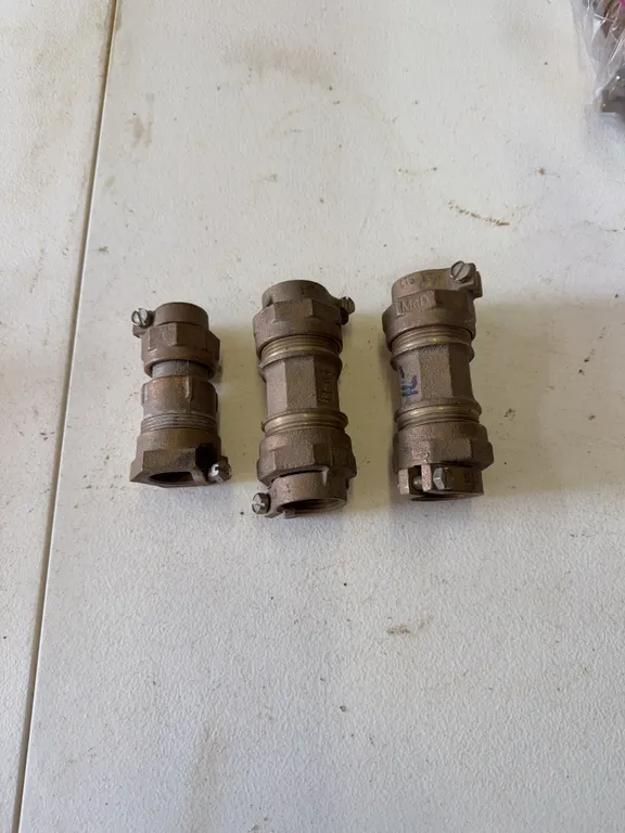 Three brass compression couplings