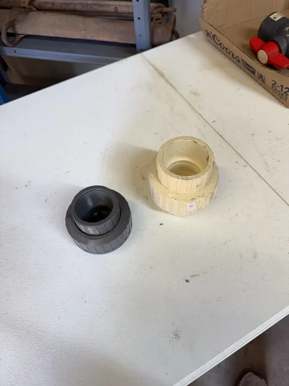2 inch PVC union, 1 1/2 inch threaded PVC union